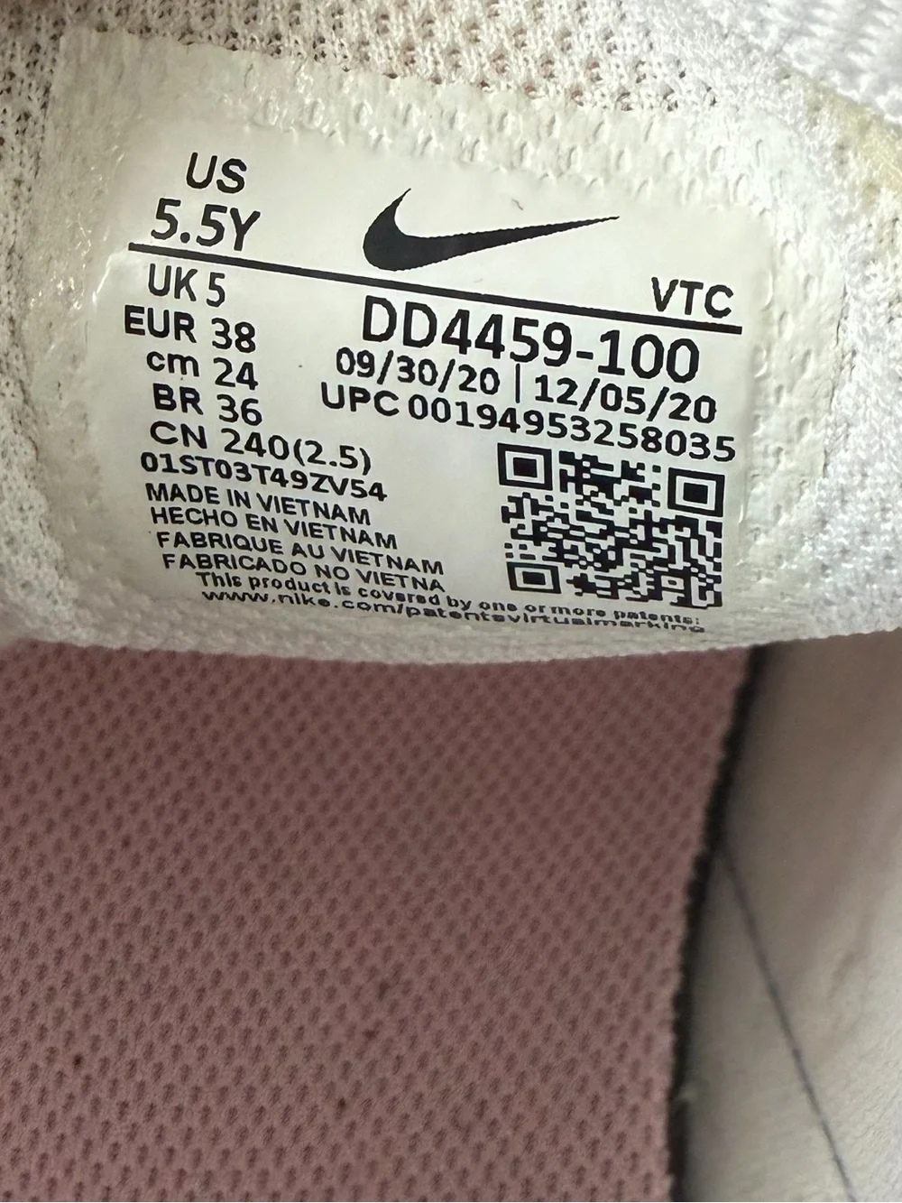 Nike Women's White Sneakers with Pastel Accent Loops